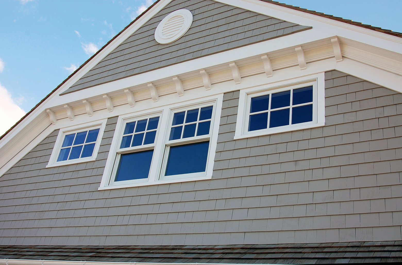 James Hardie Light Mist shingle siding with Arctic White trim and white Alside vinyl windows on a home gable.
